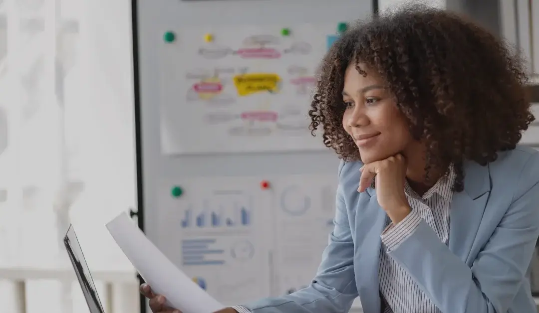 Business woman doing research at her desk