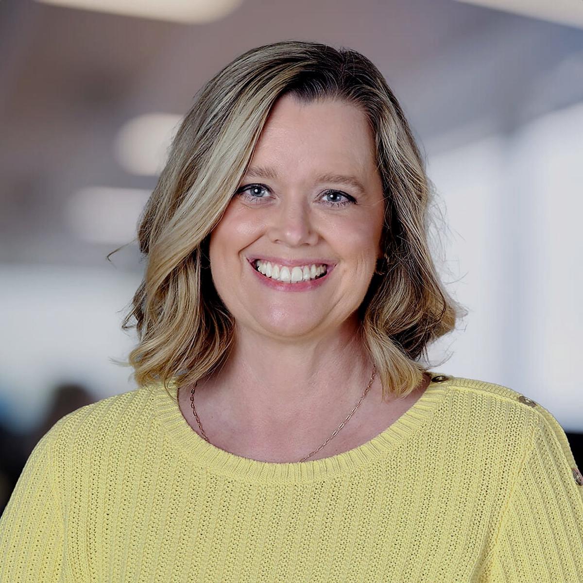 Jeane Sumner, founder of Website HQ, smiling